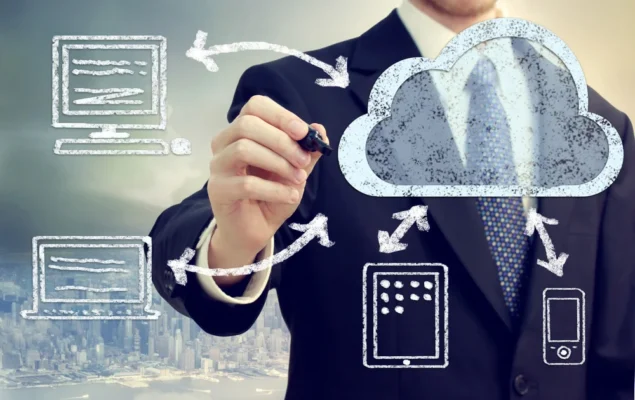 Man drawing cloud diagram on transparent board.